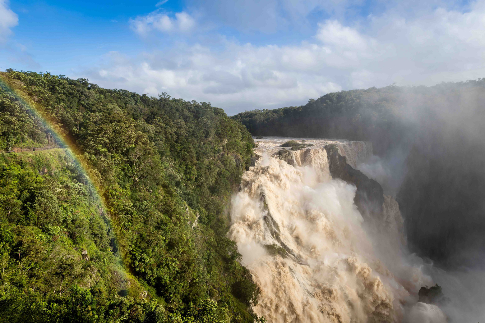 Barron Falls Barron Falls on a sunny day with a rainbow over the rainforest and train tracks